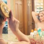 blonde girl combing her hair