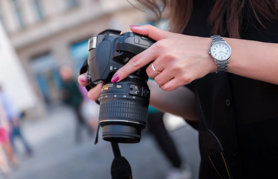 woman holding a camera